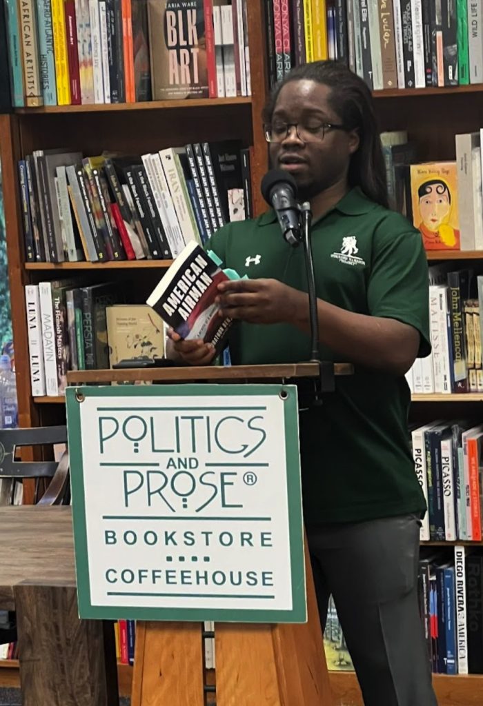 Photo of Jonathon Benjamin reading from his book American Airman at the Politics and Prose book shop in Washington D.C.